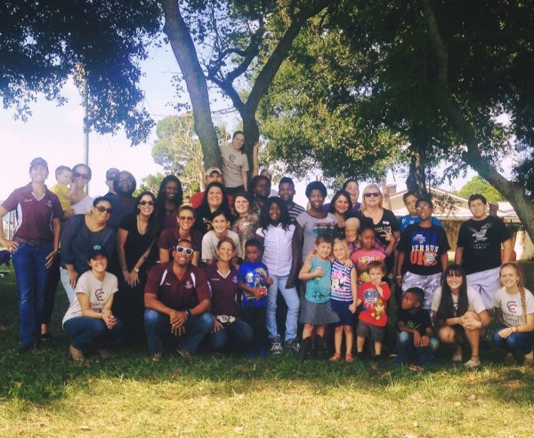 The Crossroads Corral team and volunteers posing with BaseCamp during a recent event.